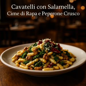 Cavatelli with Sausage, Turnip Greens, and Peperone Crusco on a plate.