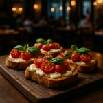 Bruschetta with cheese and cherry tomatoes on a rustic wooden board.