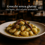 A plate of gluten-free gnocchi with butter, anchovies, and herbs.